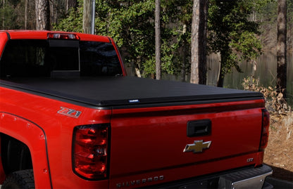 Lund 07-13 Toyota Tundra Fleetside (8ft. Bed) Hard Fold Tonneau Cover - Black